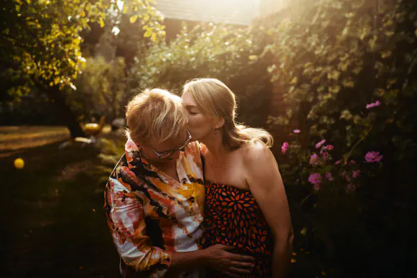 Daugther kissing her mother